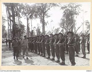 TOROKINA, BOUGAINVILLE. 1945-11-07. MAJOR GENERAL W. BRIDGEFORD, GENERAL OFFICER COMMANDING 3 DIVISION, INSPECTING THE FRONT RANK OF B COMPANY, 67 INFANTRY BATTALION, BEFORE ITS DEPARTURE TO ..