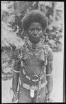 Girl of Santa Ana, wearing jewelry of porpoise and dogs teeth, shell bracelets