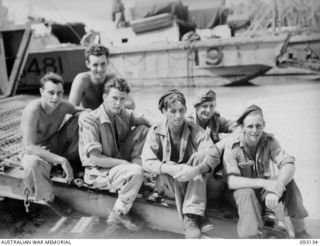 SORAKEN AREA, BOUGAINVILLE. 1945-06-12. MEMBERS OF 42 LANDING CRAFT COMPANY WHO PLAYED A HEROIC PART IN EVACUATING 31/51 INFANTRY BATTALION TROOPS FROM THE BEACH AT PORTON PLANTATION ON THE NIGHT ..