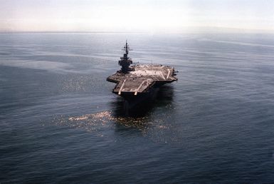 A bow view of the USS KITTY HAWK (CV-63) as crewmen form the number "200,000" on the flight deck. AN S-3A Viking has just made the 200,000th aircraft landing aboard the aircraft carrier