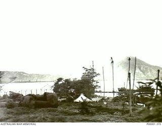 NEW BRITAIN, 1945-09. WAR DAMAGED AREA NEAR RABAUL. (RNZAF OFFICIAL PHOTOGRAPH.)