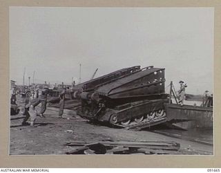 TOROKINA, BOUGAINVILLE. 1945-05-06. A 17 TON "CONVENANTER" BRIDGE TANK. THIS VEHICLE CARRIES A 20 FOOT SPAN BRIDGE WHICH CAN BE LAID BY THE DRIVER OF THE TANK WITHOUT LEAVING THE COCKPIT. THE ..