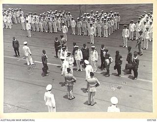 AT SEA OFF RABAUL, NEW BRITAIN. 1945-09-06. THE SURRENDER CEREMONY ON BOARD THE AIRCRAFT CARRIER HMS GLORY, SHOWING THE JAPANESE PARTY AFTER THE SIGNING OF THE SURRENDER. THE SURRENDER OF JAPANESE ..