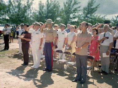 Distinguished guests stand (some saluting) during the dedication ceremony for the Congressional Medal of Honor Monument. The monument was erected to honor Marines for heroism while fighting the Japanese during World War II. They are Captain Louis Wilson, Jr., Private First Class (PFC) Leonard Mason, PFC Luther Skaggs and PFC Frank Witek