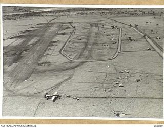 DUMPU AREA, RAMU VALLEY, NEW GUINEA. 1943-11-27. NO 2 AIRSTRIP, DUMPU. HEADQUARTERS, 7TH AUSTRALIAN DIVISION AREA, SHOWING MITCHELL BOMBER IN THE FOREGROUND