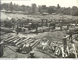 AITAPE, NORTH EAST NEW GUINEA. C. 1944-06. A RAAF SAWMILL, ESTABLISHED BY NO. 7 MOBILE WORKS SQUADRON RAAF SHORTLY AFTER THE LANDING IN THE AITAPE AREA, WHICH CUT LARGE QUANTITIES OF TIMBER FOR USE ..