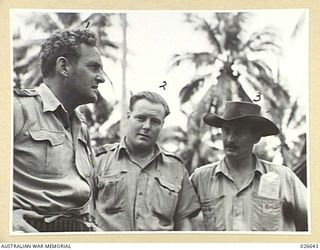 MILNE BAY, PAPUA. 1942-09. COMMANDING OFFICERS OF FAMOUS RAAF SQUADRONS. LEFT TO RIGHT:- WING-COMMANDER J.R. BALMER, COMMANDING NO 100 SQUADRON, THE FIRST AUSTRALIAN BEAUFORT TORPEDO-BOMBER ..