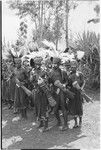 Pig festival, singsing, Kwiop: procession of decorated men with feather headdresses and kundu drums