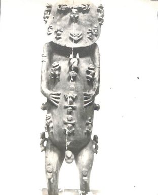 Photo of carving of a wooden male figure