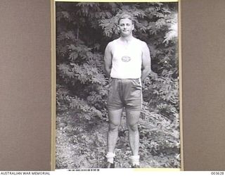 PORT MORESBY - F/O K.M. HAMPSHIRE, NO. 11 SQUADRON, RAAF BELT-MAN IN AIR FORCE TUG-OF-WAR TEAM, A.A.C. SPORTS. RAAF SURVEY FLIGHT. (NEGATIVE BY N. TRACY)