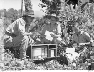 The staff of the ‘The Palmalmal Gazette the unit newspaper published by the Army Education Service Unit attached to the 5th Base Sub Area, prepare their first news sheet under difficult conditions. ..