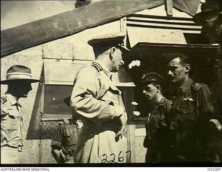 TOROKINA, BOUGAINVILLE ISLAND, SOLOMON ISLANDS. 1945-02-18. CHIEF OF AIR STAFF AIR VICE-MARSHAL JONES CB CBE DFC (CENTRE) TALKS WITH BOOMERANG PILOT 406960 FLIGHT LIEUTENANT HARRY GRIFFITHS OF ..