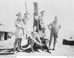 An informal group portrait of officers and senior non-commissioned officers from the Anti Aircraft Battery Rabaul at the battery's position at Frisbee Ridge not long before the Japanese attacks on ..