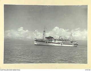 LAE, NEW GUINEA. 1944-08-14. THE 2/1ST HOSPITAL SHIP MANUNDA AT ANCHOR IN THE HARBOUR. THE VESSEL BROUGHT MEMBERS OF THE AUSTRALIAN ARMY NURSING SERVICE FROM THE 128TH GENERAL HOSPITAL (128AGH), ..