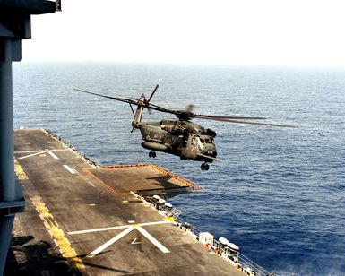 A Helicopter Combat Support Squadron 4 (HC-4) CH-53E Super Stallion helicopter takes off from the amphibious assault ship USS SAIPAN (LHA 2) during the NATO Southern Region exercise DRAGON HAMMER '90