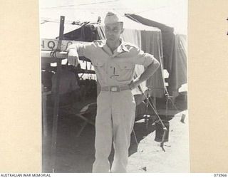 MILILAT, NEW GUINEA. 1944-09-15. CAPTAIN R.T. ALLEN, OFFICER- IN- CHARGE, UNITED STATES ARMY GENERAL HEADQUARTERS DETACHMENT ATTACHED TO HEADQUARTERS, 5TH AUSTRALIAN DIVISION