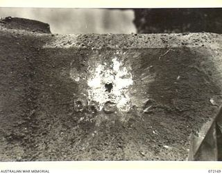 FORTIFICATION POINT, NEW GUINEA. 1944-04-08. THE STATIC EFFECT OF ROUND 12, A HOLLOW CHARGE HIGH EXPLOSIVE SHELL FIRED FROM A JAPANESE 75MM FIELD GUN, PACK TYPE, MEIJI 41 FROM A RANGE OF 150 YARDS ..