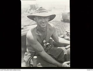 VIVIGANI, GOODENOUGH ISLAND, PAPUA NEW GUINEA. 1943-09-23. 59552 LEADING AIRCRAFTMAN N. G. CROSSLEY OF BENDIGO, VIC, FORMERELY A MINER, IS NOW A BULLDOZER OPERATOR WITH NO. 7 MOBILE WORKS SQUADRON ..