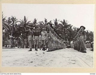 TOL PLANTATION, WIDE BAY, NEW BRITAIN. 1945-07-02. HIS ROYAL HIGHNESS, THE DUKE OF GLOUCESTER, GOVERNOR-GENERAL OF AUSTRALIA (2), ACCOMPANIED BY CAPTAIN W.A. MATES, CAPTAIN OF THE GUARD, 2/14TH ..
