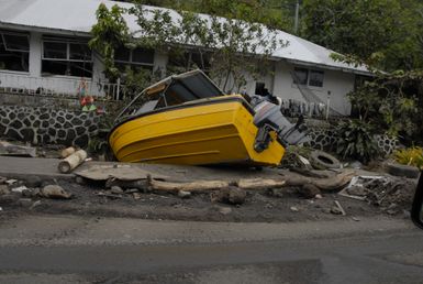 Earthquake ^ Tsunami - Pago Pago, American Samoa, October 1, 2009 -- Pago Pago, American Samoa, October 1, 2009 - A boat that was pushed landward by the tsunami that hit American Samoa sits on its side.