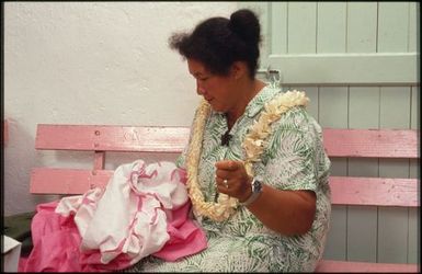 Woman sewing tivaevae