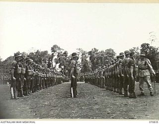 LAE, NEW GUINEA, 1944-03-08. VX20308 MAJOR-GENERAL F.H. BERRYMAN, CBE, DSO (1), GENERAL OFFICER COMMANDING 2ND AUSTRALIAN CORPS, INSPECTING UNITS OF THE 29TH INFANTRY BRIGADE. THE BRIGADE HAS BEEN ..