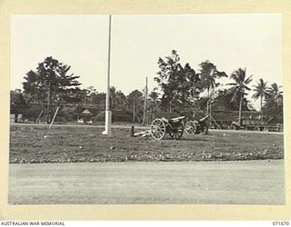 LAE, NEW GUINEA. 1944-03-24. ADMINISTRATION BUILDINGS VIEWED FROM THE ENTRANCE TO HEADQUARTERS LAE BASE SUB-AREA. (JOINS WITH PHOTOGRAPH NUMBERED 071666 TO 071672 SHOWING THREE CAPTURED JAPANESE ..