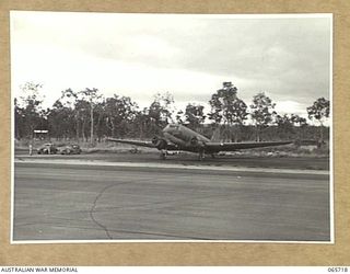 MAREEBA, QLD. 1944-04-10. THE DOUGLAS C47 AIRCRAFT, MILITARY VERSION OF THE DC3 AIRLINER, "IRENE" (CALL SIGN VH-CFB) OF THE UNITED STATES ARMY AIR FORCE, WITH AN ALL-AMERICAN CREW, ON THE STRIP ..