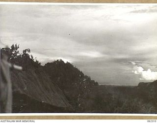 SHAGGY RIDGE, NEW GUINEA. 1943-12-27. 500 POUNDER BOMBS DROPPED FROM UNITED STATES ARMY FIGHTER AIRCRAFT EXPLODING ON JAPANESE POSITIONS ON THE "PIMPLE" DURING THE 2/16TH AUSTRALIAN INFANTRY ..