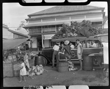 Fruit stall, Papeete, Tahiti, showing large amounts of fruit on the top of a bus