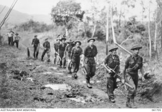 WAREO, NEW GUINEA. 1943-12-09. MEMBERS OF C COMPANY 2/23RD AUSTRALIAN INFANTRY BATTALION MOVING UP THE LINE. IDENTIFIED PERSONNEL ARE: VX40097 PRIVATE (PTE) E. F. LAWRENCE (1); VX42874 PTE L. ..