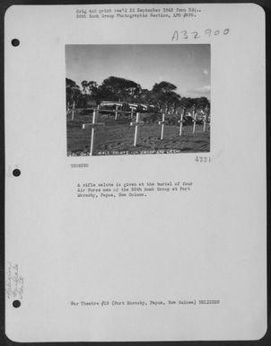 A rifle salute is given at the burian of four Air Force men of the 38th Bomb Group at Port Moresby, Papua, New Guinea. (U.S. Air Force Number 3A32900)