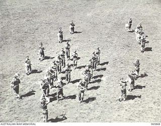 WONDECLA, QLD. 1944-04-23. BAND OF THE 2/1ST INFANTRY BATTALION PRACTICING ROUTINE MARCHES ON THE HERBERTON RACECOURSE