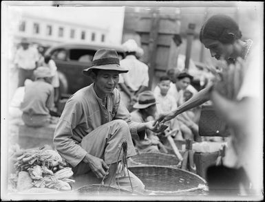 An unidentified vendor at a market, Fiji