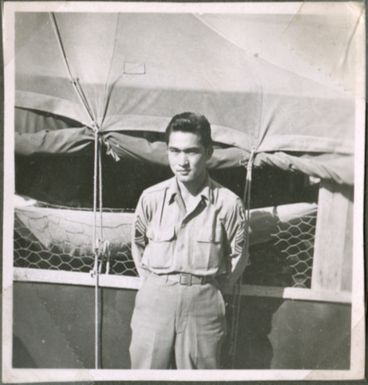 Soldier in front of tents