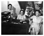 [Three ANC nurses at a desk, circa 1945]