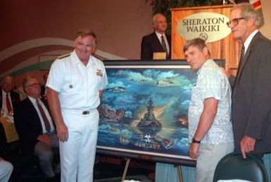 The painting portraying the Japanese attack on Pearl Harbor is unveiled during the Pearl Harbor Survivors Association Banquet
