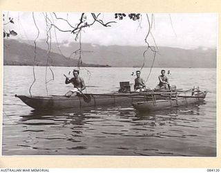 MALMAL VILLAGE, JACQUINOT BAY. NEW BRITAIN. 1944-12-09. HEADQUARTERS 5 DIVISION TROOPS OUT FISHING IN A NATIVE LAKATOI. LEFT TO RIGHT:- LANCE-CORPORAL V. J. MCLAUCHLAN; CORPORAL P. A. FORD; PRIVATE ..