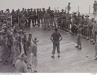 SYDNEY HARBOUR, NSW 1945-12-05. AUSTRALIAN LONG SERVICE PERSONNEL PLAYING DECK TENNIS ON THE FLIGHT DECK OF THE ROYAL NAVY AIRCRAFT CARRIER, HMS VINDIX. THEY ARE PART OF THE DRAFT OF 350 LONG ..