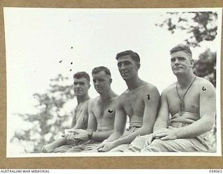 MILNE BAY, NEW GUINEA, 1943-07-12. LEFT TO RIGHT: NX30033 CORPORAL H.J. ROGERS; NX69042 PRIVATE M.W. NEILSON; NX7321 PRIVATE N. EGAN AND WX12858 PRIVATE A.J. CLARK, ALL OF THE 18TH PLATOON, 2/1ST ..