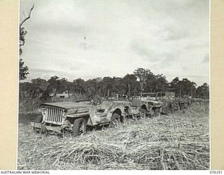 LAE, NEW GUINEA. 1944-09-27. A LINE-UP OF WRECKED JEEPS IN THE PARK OF THE 43RD FIELD ORDNANCE DEPOT