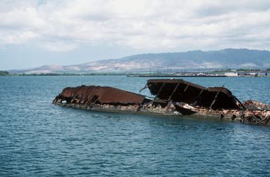 A view of the wreck of the former battleship/target ship UTAH (BB-31/AG-16), which was sunk at her moorings on the west side of the Ford Island on December 7, 1941, during the Japanese attack on Pearl Harbor