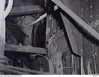 PORT HERVEY, PAPUA. 1943-05-09. BOMB DAMAGE TO THE PLATES OF THE MERCHANT VESSEL NOORA, DAMAGED BY JAPANESE AIR ATTACK. (NAVAL HISTORICAL COLLECTION)