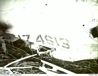 NEW IRELAND, 1945-09/10. CLOSE UP OF THE SERIAL NUMBER OF CRASHED LOCKHEED VENTURA AIRCRAFT NZ4613. (RNZAF OFFICIAL PHOTOGRAPH.)