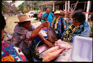 Woman selling fish, Niue