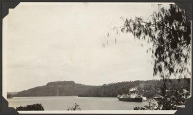 Apia harbour with a ship tied up at the wharf, Samoa, 1929 / C.M. Yonge