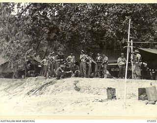 LAE, NEW GUINEA. 1944-04-03. THE TEMPORARY CAMP SITE OF THE 19TH LINES OF COMMUNICATION SIGNALS AND THE 22ND EMPLOYMENT COMPANY AT LABU INLET, LAE BASE SUB-AREA. THE BACKGROUND IS TYPICAL OF THE ..