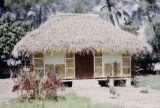 French Polynesia, thatched-roofed cottage on Tahiti Island