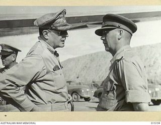 1943-07-07. NEW GUINEA. PACIFIC OFFENSIVE. GENERAL DOUGLAS MACARTHUR, WHO IS IN COMMAND OF THE ALLIED OFFENSIVES IN NEW GUINEA AND THE SOLOMONS, PHOTOGRAPHED BESIDE HIS PLANE IN NEW GUINEA. WITH ..