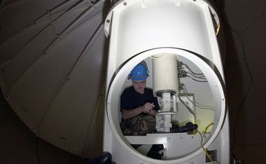 US Air Force (USAF) Technical Sergeant (TSGT) Steven Goodlett cleans the slip rings in the NEXRAD (NEXt Generation RADar) Doppler weather radar at Andersen Air Force Base (AFB), Guam